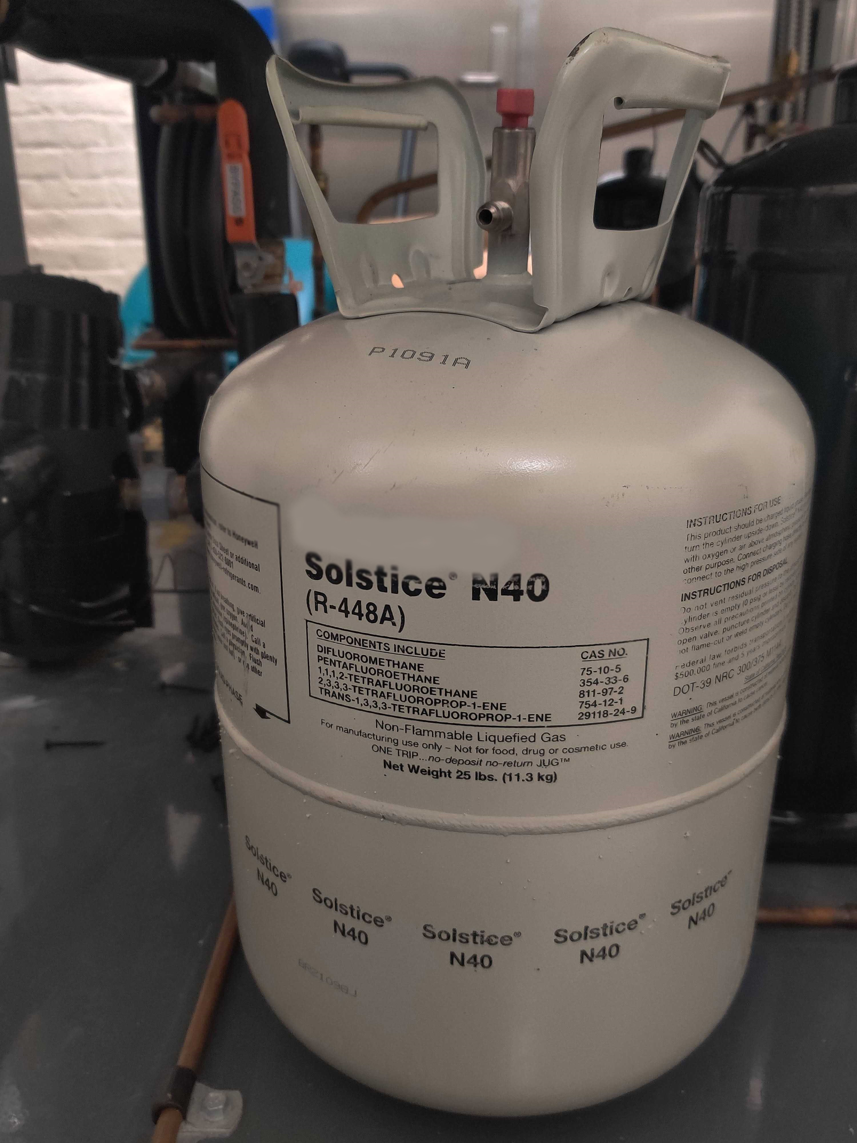 This 25 pound can of R-448A refrigerant, if emitted, would have the same climate impact as 16 metric tons of CO2. R-448A is a newly introduced refrigerant specifically engineered to be less harmful than dominant HFCs. Photo: Tilden Chao, 2022.